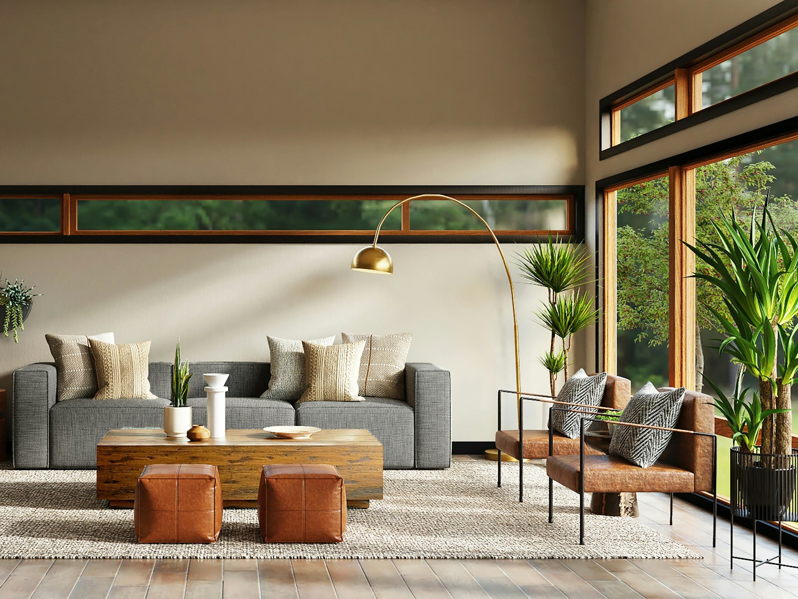 Living room with a grey sofa, cognac leather ottomans, a brass arc lamp and floor-to-ceiling windows